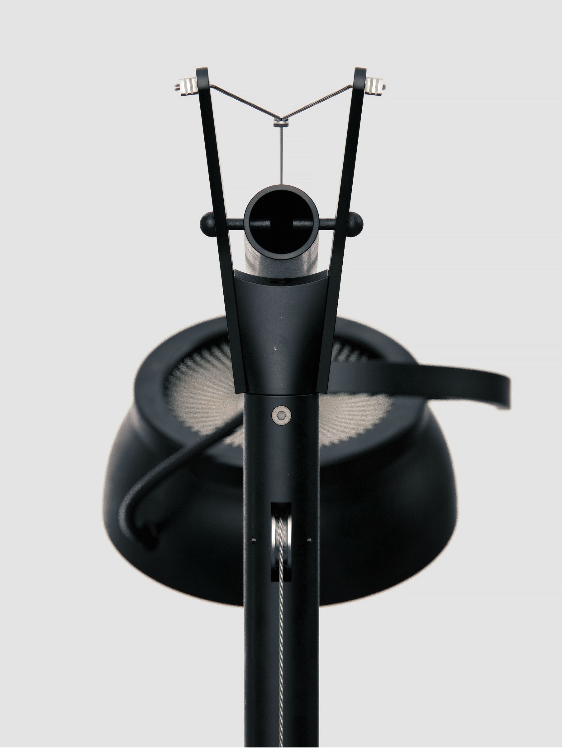 Close-up of the top joint mechanism, showing the cable-tensioning hub detail at the pivot.