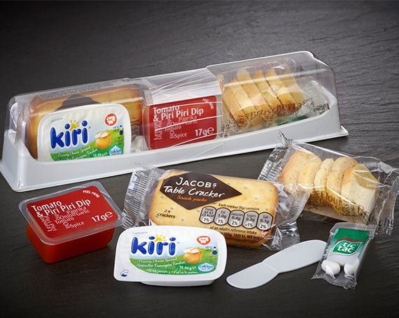 Photo of a snackbox with its contents laid out in front of it.